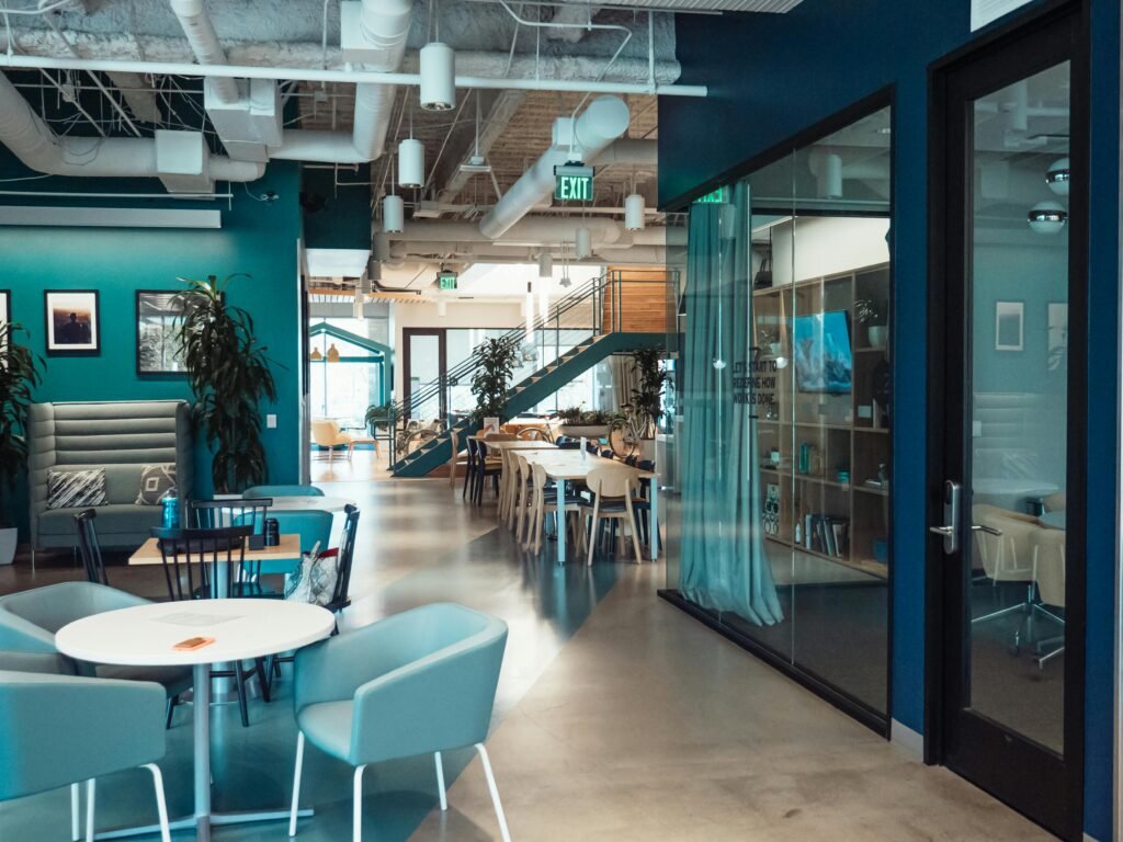 pexels-photo-7651627-7651627 Open and collaborative modern office space with stylish furniture and natural lighting.